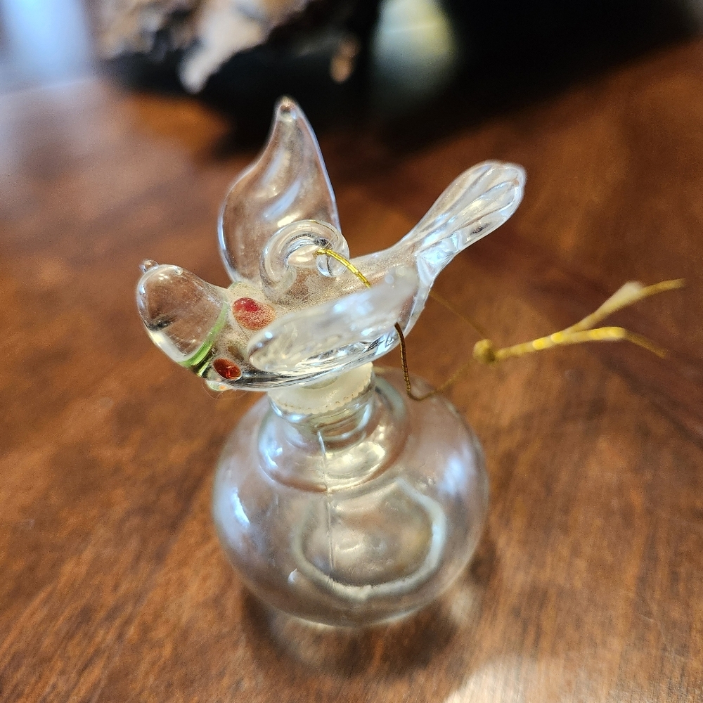 vintage Bols miniature liquor bottle featuring a hand-blown glass bird stopper. 